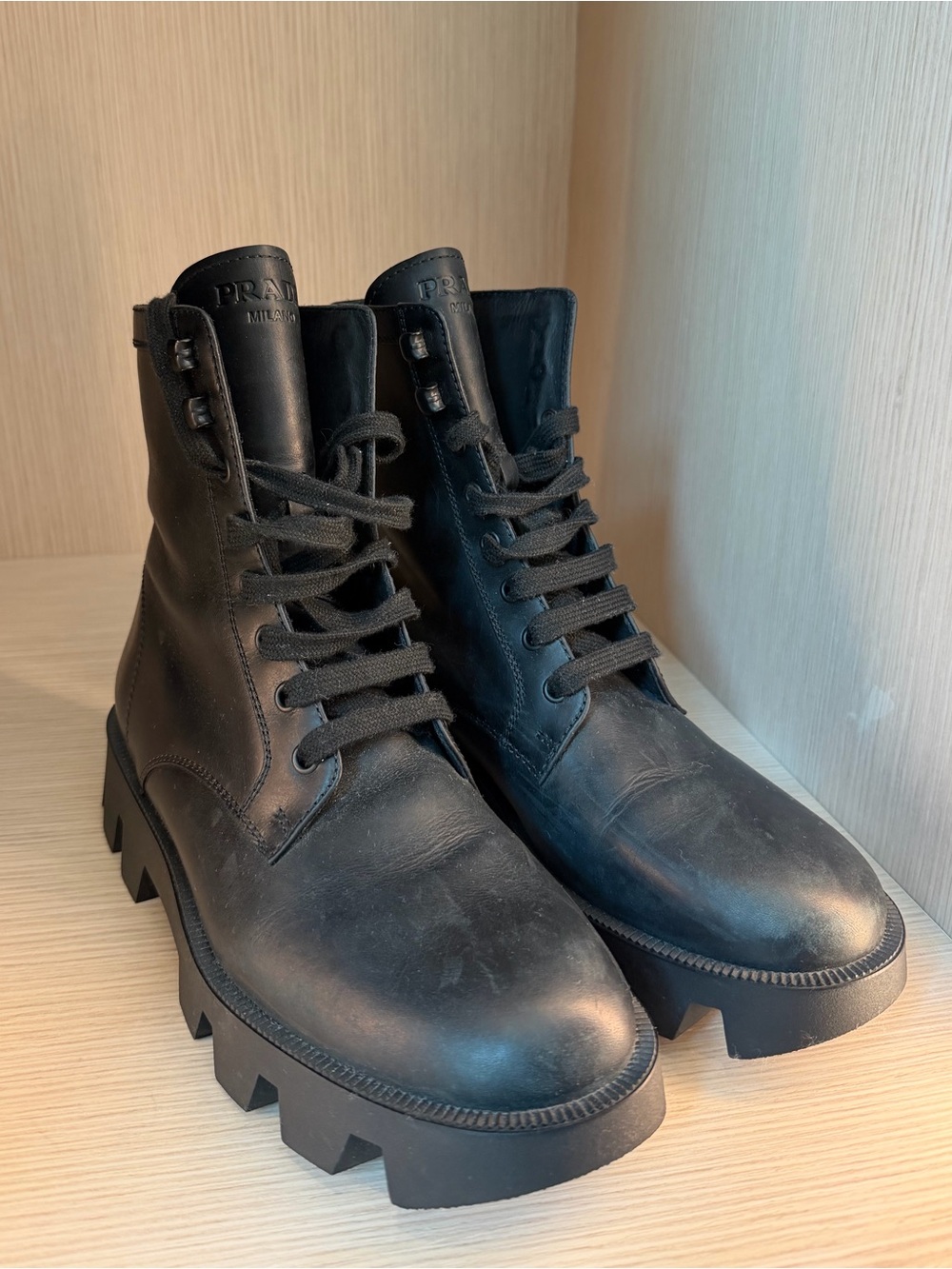 Prada Black Leather Lug-Sole Lace-Up Boots.
